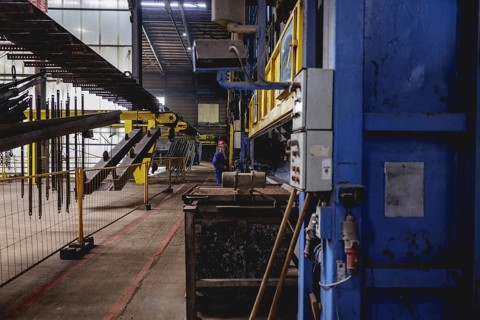 A worker stands at a boiler during a galvanising process. Taken during a press event at The Coatinc