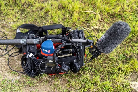 Symbolic image media, sound recorder, with microphones, sound boom, headphones, of a TV team of the