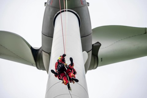 Height rescuers from the Gelsenkirchen fire brigade practise abseiling from a wind turbine from a