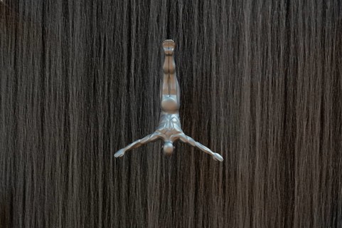 Interior view, The Waterfall, artificial indoor waterfall with life-size jumper sculptures,