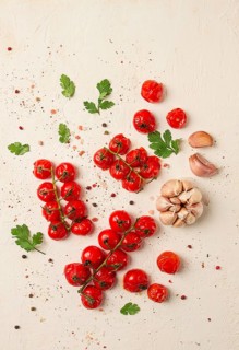 Baked branch, mini, cherry tomatoes, with spices and herbs, garlic, food background, top view, on a