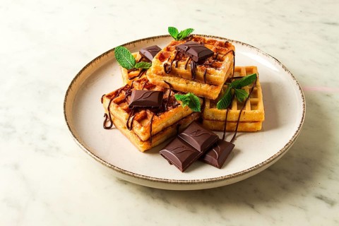 Viennese waffles, with chocolate, breakfast, on a beige background, no people, selective focus,