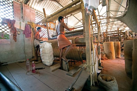 Indian workers in the weaving mill of the Labourers Coir Mats and Mattings Cooperation, coir mat
