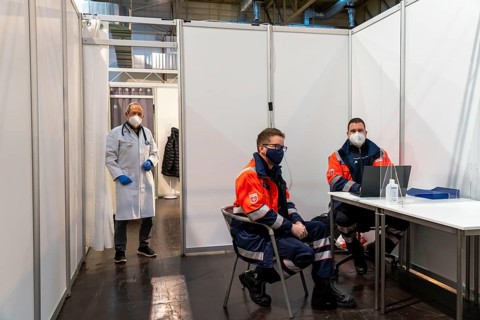 Vaccination team, vaccination doctor and helpers at the test run in the vaccination centre for the