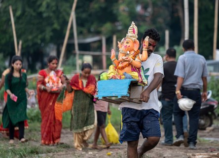 Devotees carries the Ganesha idol to immerse in the Brahmaputra river, during Ganesh Chaturthi