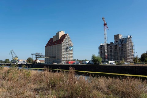 Old silo building, warehouse, construction crane in front, Magdeburg Port of Science,