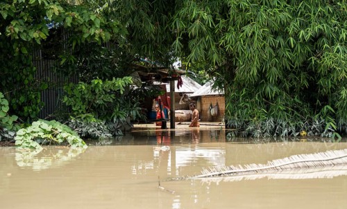 Morigaon, India. 4 July 2024. Residents in their flooded house, in a flood affected village in