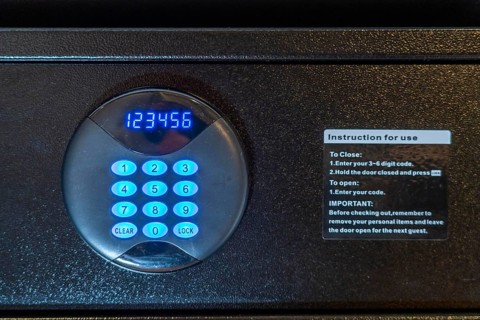 Room safe in a hotel, keypad for entering a 6-digit numerical code to lock the safe for depositing