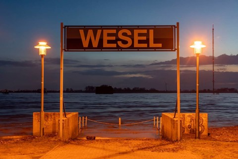 Rhine flood, riverside promenade in Wesel, the river water is already spilling onto the paths,