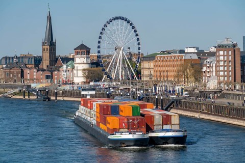 Container freighter, Milliennium II, as a coupling unit, on the Rhine, on the banks of the old