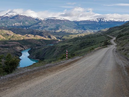 Road Carretera Austral north of Cochrane, gravel road along river Rio Baker, Patagonia, Chile,