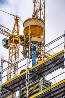 Concreting work on a construction site, new construction of a high-rise office building, facade of