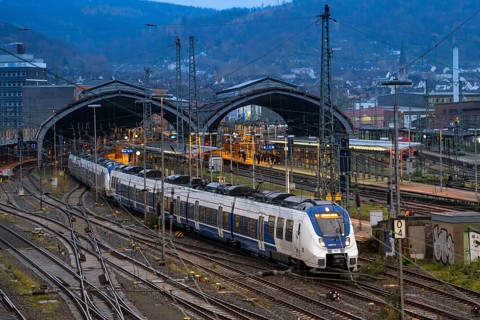 The main railway station of Hagen, station halls, tracks, platforms, regional express train of