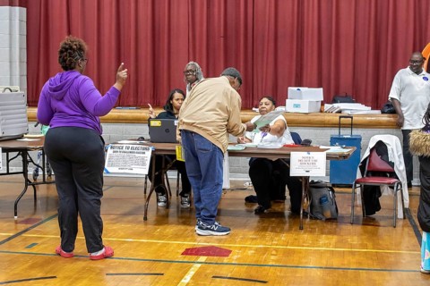 Detroit, Michigan USA, 5 November 2024, A voter gets his ballot for the 2024 presidential election