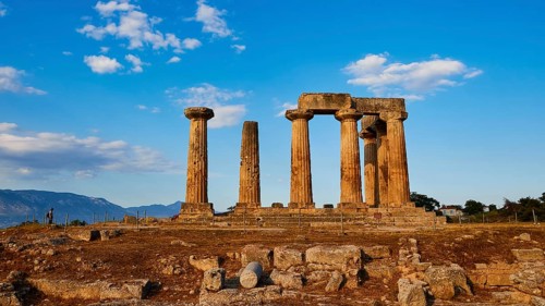 Archaic Temple of Apollo, Doric columns, Sunset light illuminates the columns and ruins of a