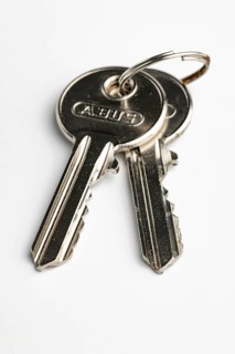 Key ring with two keys on a key ring, white background