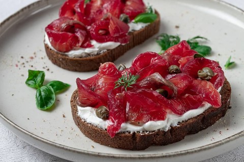 Sandwiches with gravlax salmon, cream cheese, capers, greens, breakfast, homemade