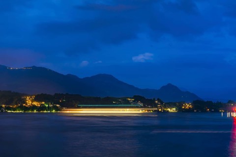Nautical Vessel on Lake Lucerne in Long Exposure at Night with Mountain in Switzerland
