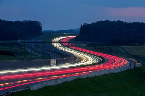 Tracers on the A8 motorway, winding road, evening, long exposure, Swabian Alb, Baden-Württemberg,