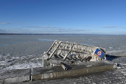 Frozen lake, ice and structures on iron ladder, Illmitz, Lake Neusiedl, Burgenland, Austria, Europe