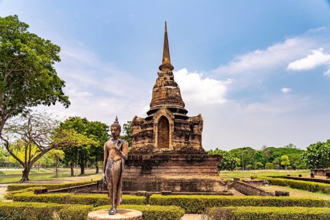 Buddha statue and chedi of the Buddhist temple Wat Sa Si, UNESCO World Heritage Sukhothai