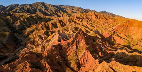Aerial view, eroded mountain landscape, sandstone cliffs, canyon with red and orange rock