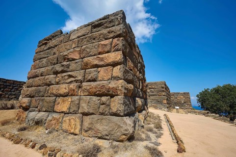 Ancient ruined wall in a dry landscape under a clear blue sky, Palaiokastro, Ancient fortress, 3rd