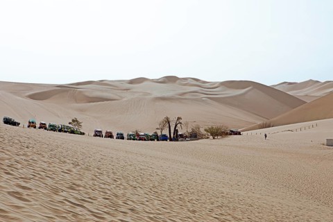 Beach buggies in the dune landscape, Laguna de Huacachina oasis, Ica, Ica region, Ica province,