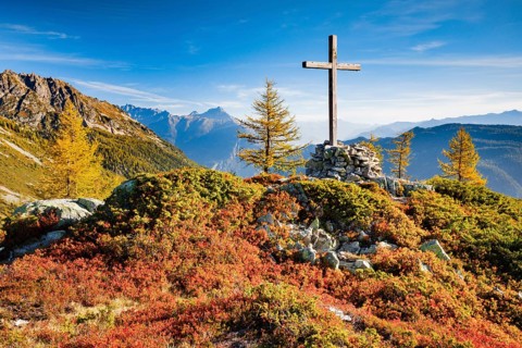 View of the Valais mountains and the Rhone valley with summit cross in autumn, Lower Valais,