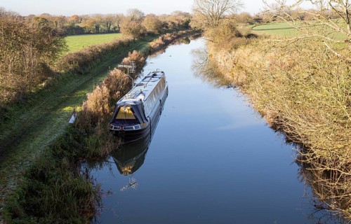 Narrowboat on Kennet and Avon canal, Woodborough, Wiltshire, England, UK