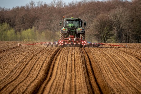 Sugar beet being sown in spring, precision sowing with precision seed drill, behind a tractor,