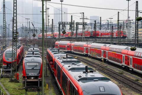 Railway tracks with regional trains, after freezing rain, in front of Frankfurt main station,
