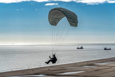 Paragliders along the dunes of Zoutelande, in Zeeland, South Holland, Netherlands