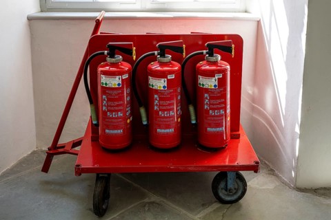 Handcart, equipped with fire extinguisher in the cloister, Salem Castle, former imperial abbey,