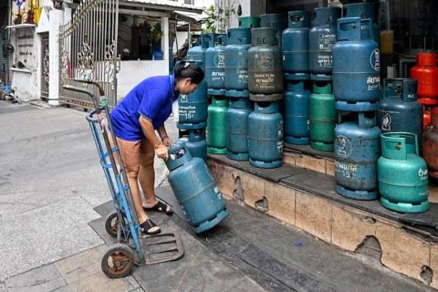 Gas cylinder woman with trolley