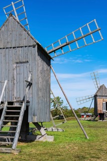 Three traditional historic windmills (Resmo väderkvarnar) in the village of Resmo on Öland, Kalmar