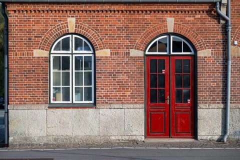 Window and red door, railway station building, Humblebæk, Hovedstaden, Øresund coast, Denmark,