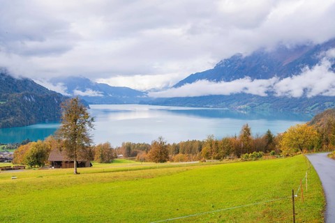 Picturesque lake landscape with mountains and clouds in the background, Lake Brienz, Switzerland,