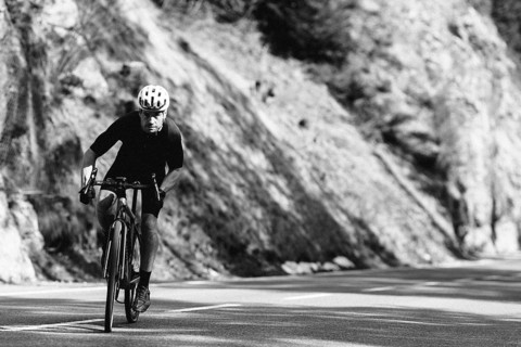 Road bike rider in spring between Lechtal and Tannheimer Tal in front of picturesque scenery of the