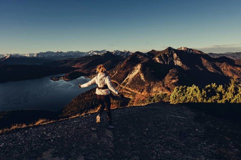 Trail running in autumn on the Jochberg on Lake Walchensee against the wonderful backdrop of the
