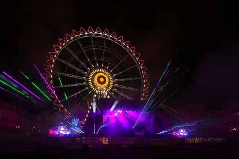 Night shot, rehearsal for New Year's Eve party, theatre, laser show, light show, Ferris wheel,