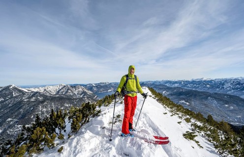 Ski tourer at the summit of Simetsberg, mountain panorama, Estergebirge, Bavarian Prealps, Bavaria