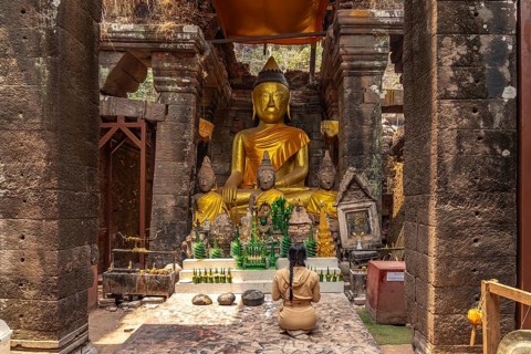 Modern Buddha statues in the central sanctuary of the mountain temple Wat Phu, Champasak province,