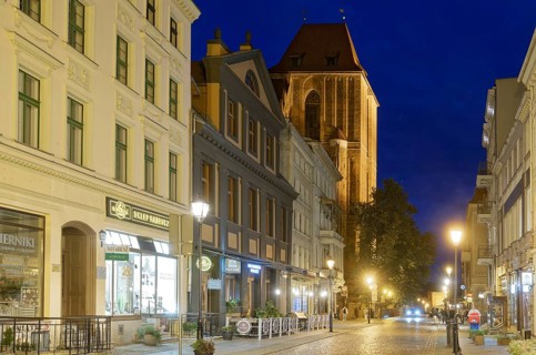 The medieval old town of Thorn illuminated in the evening. The historic city centre of Torun is a