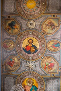 Detailed orthodox fresco on a church ceiling with religious icons and symbolic elements, Panaghia