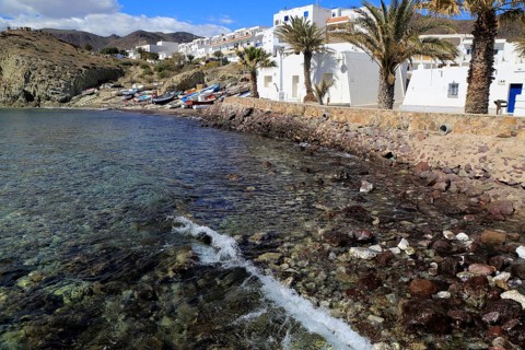 Small fishing boats and whitewashed houses, Isleta de Moro village, Cabo de Gata natural park,