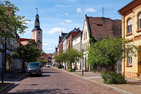 Residential and commercial buildings in Rudolf-Breitscheid-Straße, paved with cobblestones, in the
