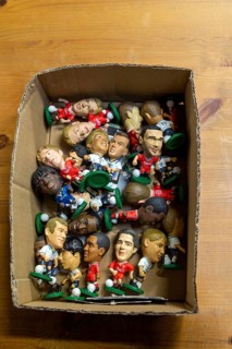 Plastic models of football players in cardboard box, UK