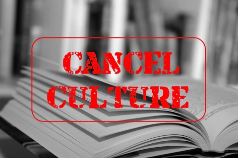 Symbolic image of the debate on the so-called cancel culture with an open book and a large red