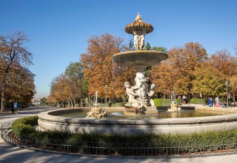 People walking by monument fountain in El Retiro park, Madrid, Spain, Europe